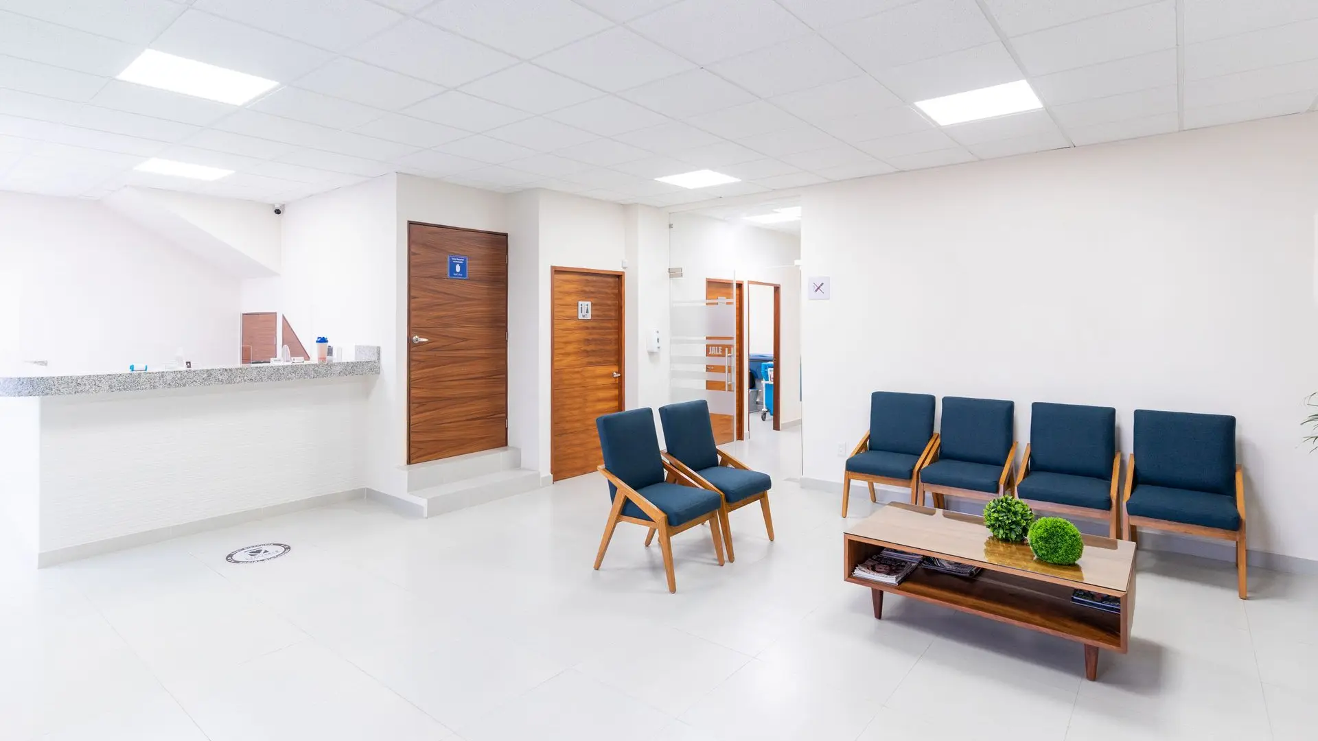 A bright, modern medical waiting room with comfortable seating